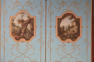 Painted wall panelling with landscape paintings
