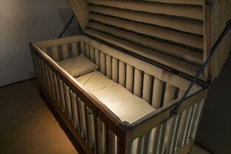 19th century padded cage bed for epileptics in the Dr Guislain Museum about the history of psychiatry in the former Guislain Hospice