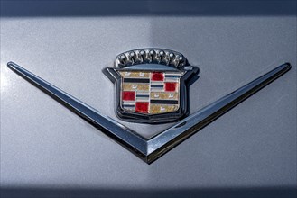 Logo Cadillac on vintage car Coupe DeVille at the rear