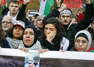 A woman cries during the Global South Unites demonstration. Palestinians and other participants gathered to protest against Israel's actions in the Gaza Strip and called for an immediate ceasefire