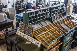 Type case in composing room at printing business
