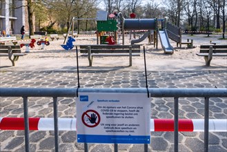 Deserted public children's playground closed and obstructed with tape due to the 2020 COVID-19