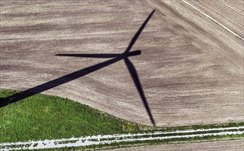 Shadow of a windmill in a wind farm