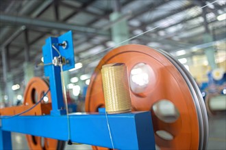 Industrial production of fiber optic cable for telecommunication systems. Manufacturing of modern fiberglass and fiber optic cables at the factory