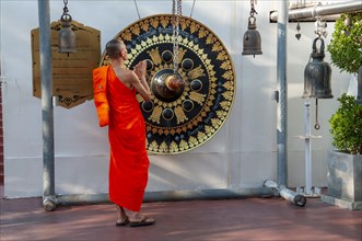 Monk in front of a ritual gong