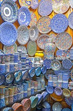 Decorative and colourful ceramics and pottery on display in souvenir shop in medina of the city Fes