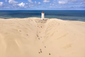 Aerial view of Rubjerg Knude lighthouse in a large sand dune