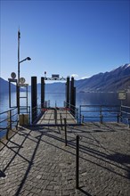 Backlit photograph of the jetty on Lake Maggiore in Ascona