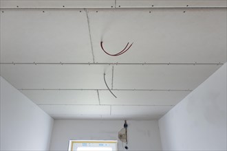 Plasterboard panels under the ceiling
