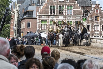 Knights in armour on horseback on filmset in Ghent