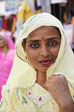 Indian woman with yellow shawl