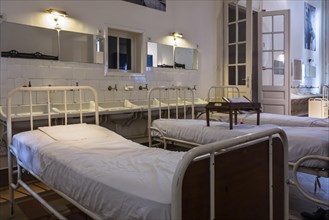 Hospital beds in the Dr Guislain Museum about the history of psychiatry in the former Guislain Hospice