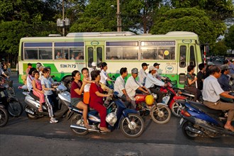 Mopeds and bus in the streets of Saigon