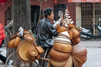 Basket seller in street of Hanoi