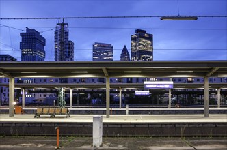 Platform at Frankfurt Central Station with a view of high-rise buildings in the banking district