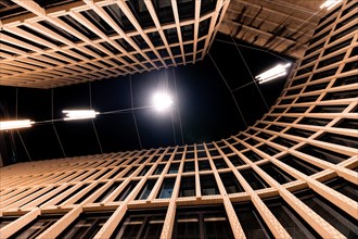 Interior view of a circular building structure with lighting from above