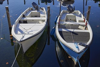 Motorboats moored to duckboards on Lake Maggiore in Ascona