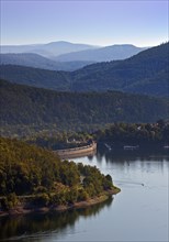 Elevated view of the Edertalsperre dam with the dam wall and a wide view of the Kellerwald-Edersee National Park