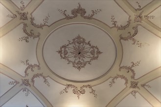 Detailed view of the historic stucco ceiling in the Palazzo Reale