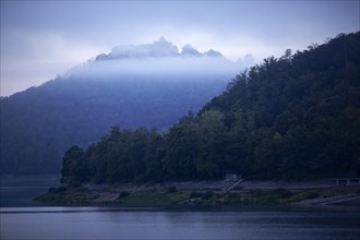 Lake Edersee with a view of Waldeck Castle in the morning mist