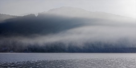 Edertalsperre with fog on the Edersee in the early morning
