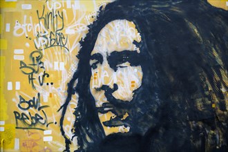 Bob Marley mural with song titles