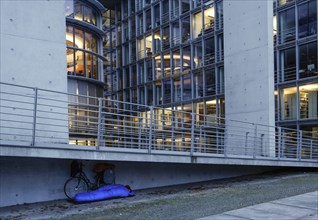 A homeless man sleeps in a sleeping bag at the Paul Loebe Haus. Aid organisations register an increase in homeless people