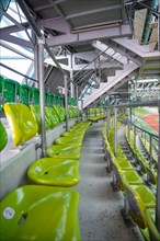 Rows of green seats in a stadium