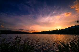 Summer Solstice Sunset on a lake in Catskills Mountains