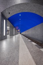 Underground station at night with simple design and clear blue sky