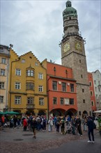 Tourists in front of the city tower in the historic centre of Innsbruck