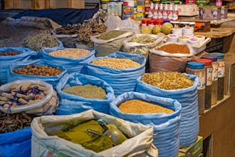 Large bags with spices and nuts in food shop in medina of the city Meknes