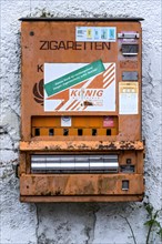 Rotten, rusty cigarette vending machine, device temporarily out of service due to youth protection,