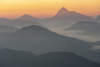 Morning atmosphere over mountain ranges, twilight, haze, fog, backlight, view from Jochberg to