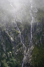 Cloudy mountain landscape, mountain streams as waterfalls on a mountain slope, Furtschaglhaus,