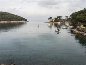 View from the promenade path to a bay, small harbour, near Veli Losinj, Kvarner Bay, Croatia,