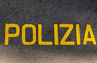 Police Written on the Asphalt Street in Italian Language in a Sunny Day in Lugano, Ticino,