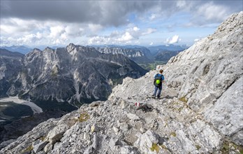 Mountaineer on a narrow rocky ridge, Watzmann crossing to the Watzmann Mittelspitze, view of
