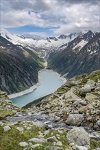 Mountain landscape, view of turquoise-blue lake Schlegeisspeicher, glaciated rocky mountain peaks