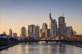 The light of the setting winter sun falls sideways onto the buildings of the Frankfurt banking