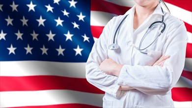 Female doctor with stethoscope on American flag. Unrecognizable female doctor with arms crossed on