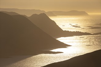 View from Nordkapp over the Norwegian coast, mountains, backlight, Finnmark, Norway, Europe