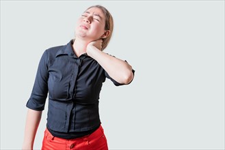 Young woman with muscle tension and neck pain isolated. Stress and neck pain concept, Girl