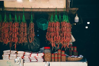 Small shop displaying traditional pork and beef sausages called twa koh, kwah koh or sach krok,