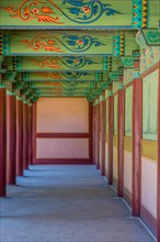 Buyeo, South Korea, July 7, 2018: Walkway under pavilion with details of colorful ceiling at