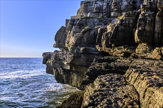 Beautiful cliffs and rock formations in Peniche, Portugal, on sunny day. Weathered rock formations,