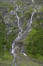 Mountain stream flowing down a steep rocky slope, Berliner Hoehenweg, Zillertal, Tyrol, Austria,