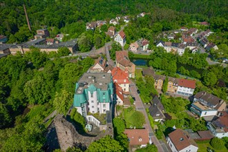 Drone view of a small town with green roofs and dense woodland, Pforzheim, Rabeneck Youth Hostel,