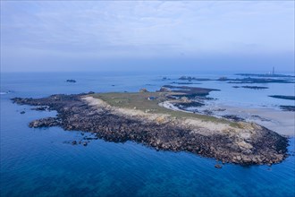Aerial view of the island Ile Stagadon, in the background the lighthouse Phare de l'Ile Vierge, in