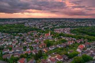 Aerial view of a city at dusk with church tower and cloudy sky, Pforzheim, Germany, Europe